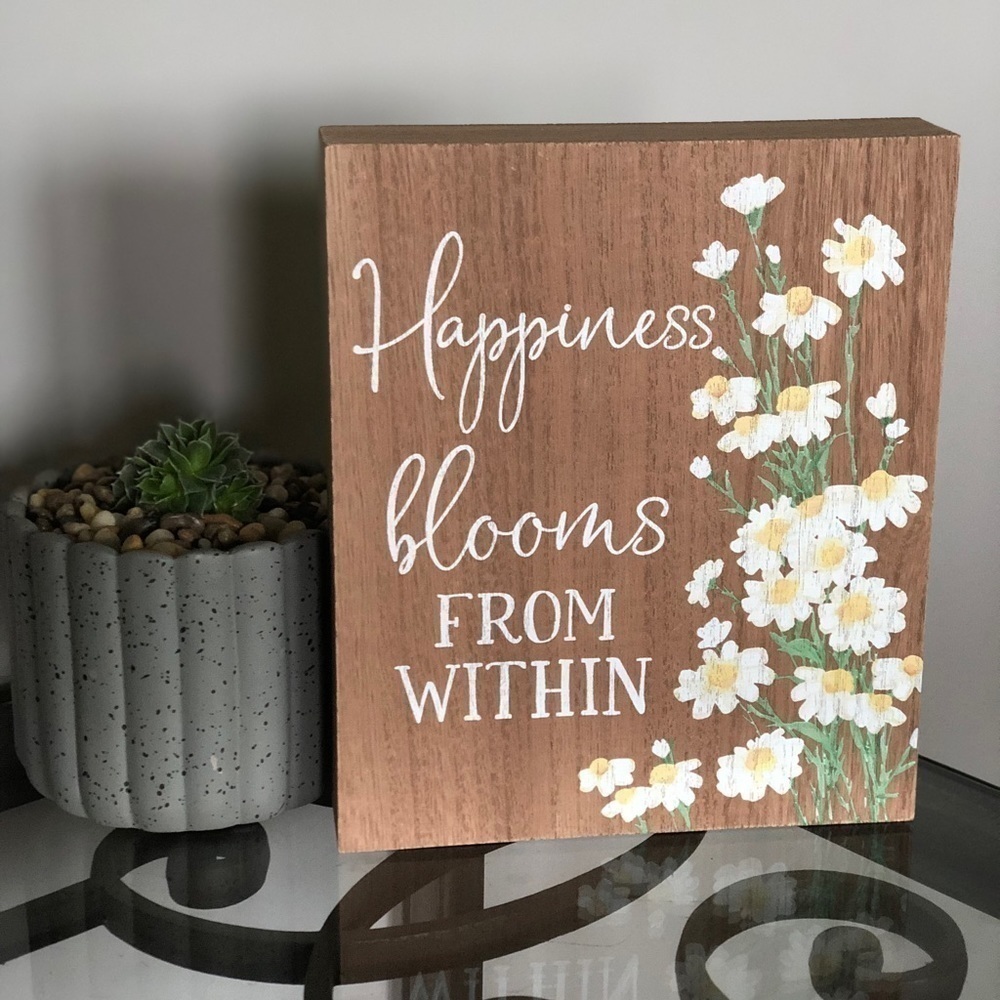 “happiness blooms from within” home decor sign